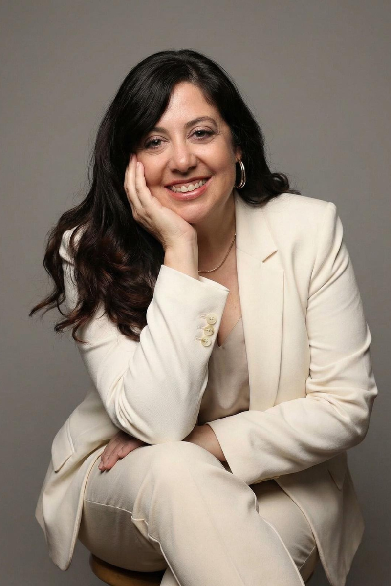 Becky Webb in business suit posing for headshot.